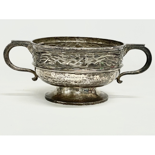 529 - A large silver presentation trophy. 708grams. Birmingham mark. 30x19x11cm.