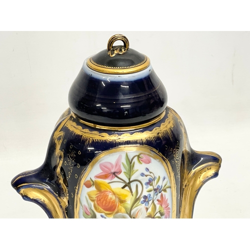 157 - An early 20th century German gilt colt blue porcelain urn. Converted from a lamp. 18x26cm.