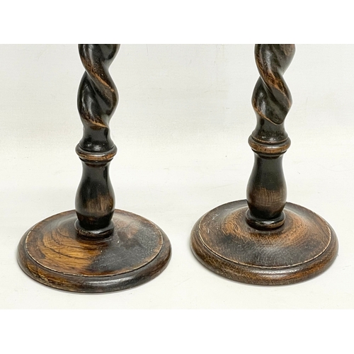 160 - A pair of tall early 20th century Barley Twist oak candlesticks. 1900-1910. 13.5x32cm.