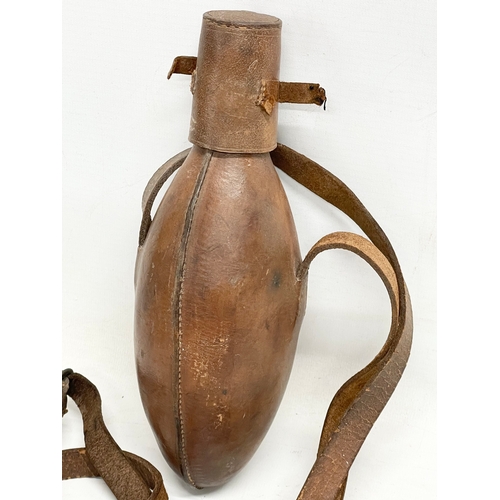 162 - A Victorian leather bound flask. 25cm.