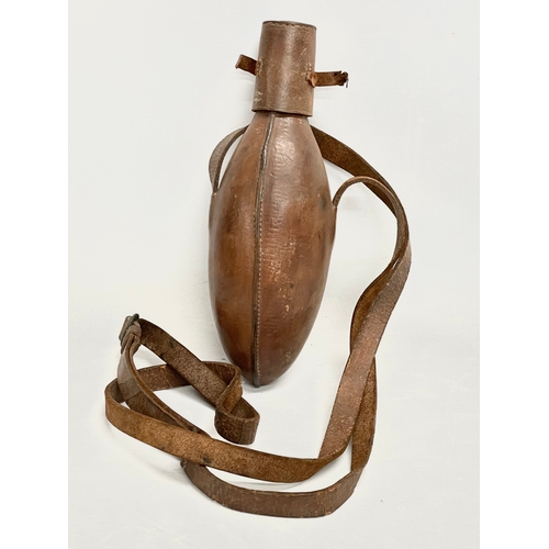 162 - A Victorian leather bound flask. 25cm.