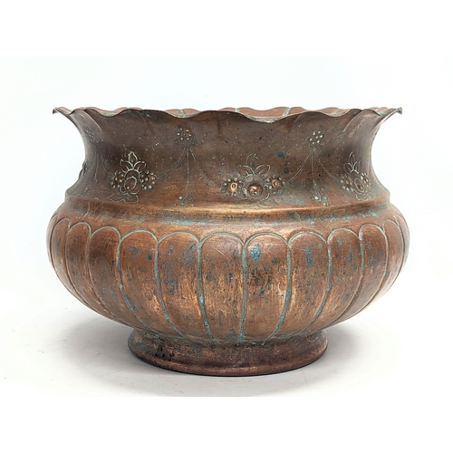 104 - A late 19th century ornate copper jardiniere. 31x21cm