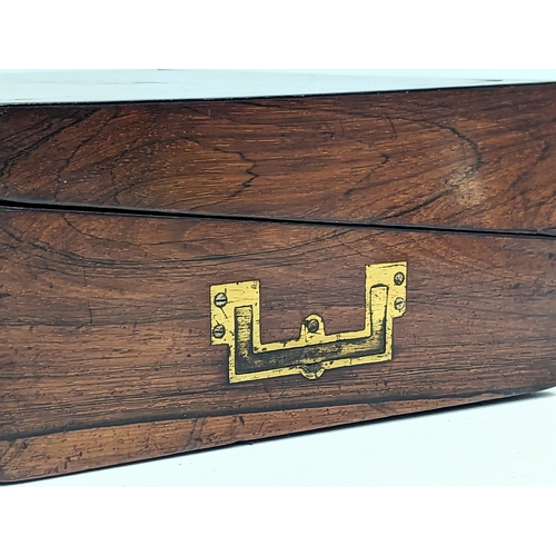 105 - A Victorian rosewood brass inlaid writing slope. 30.5x23.5x11.5cm