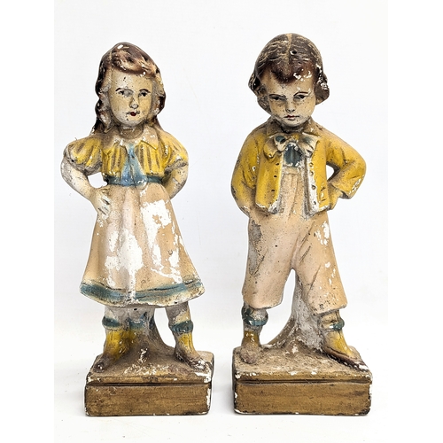 173 - A pair of early 20th century plaster figures. 34cm