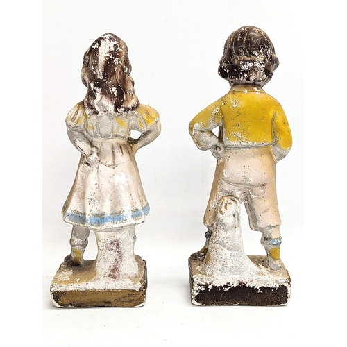 173 - A pair of early 20th century plaster figures. 34cm