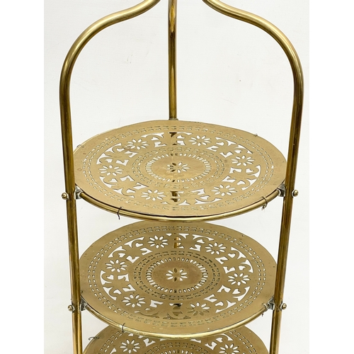 114 - A late 19th century brass 4 tier cake stand. 41x89cm