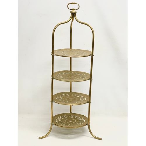 114 - A late 19th century brass 4 tier cake stand. 41x89cm