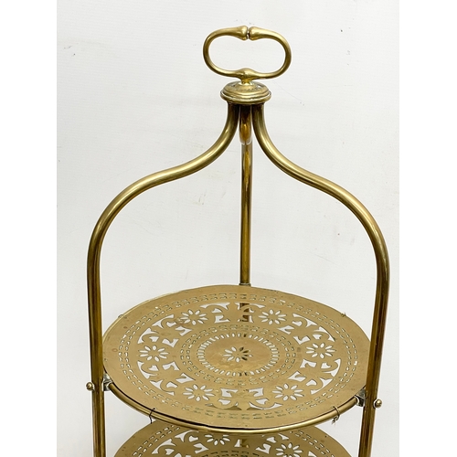 114 - A late 19th century brass 4 tier cake stand. 41x89cm