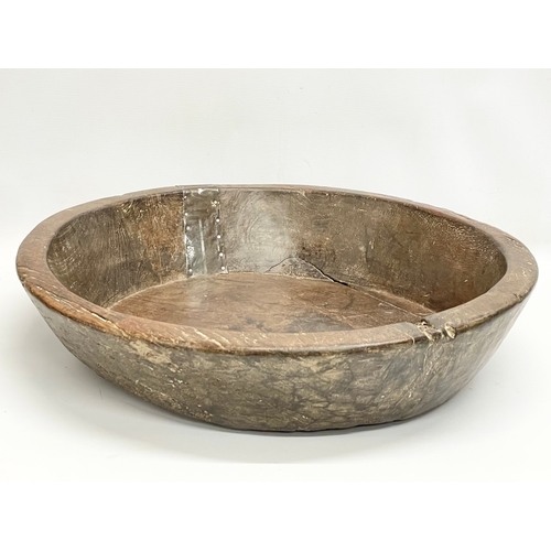 59 - A large late 19th/early 20th century Indian food preparation bowl. 53x54x11cm