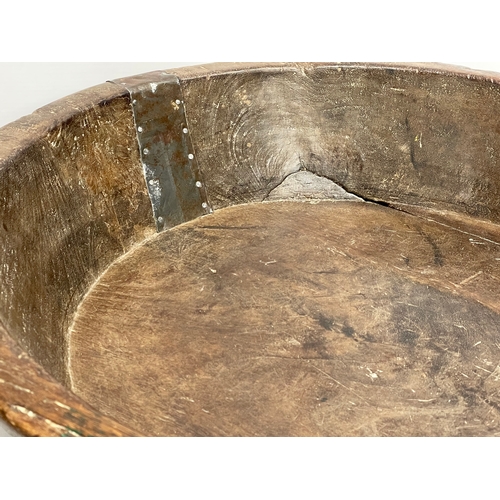 59 - A large late 19th/early 20th century Indian food preparation bowl. 53x54x11cm