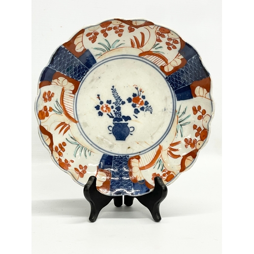 117 - An 18th century Chinese Imari pattern plate and a late 19th century Japanese Imari plate. 23cm