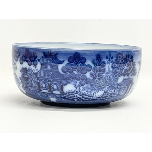 181 - A late 19th century Doulton Burslem ‘Willow’ pattern bowl. 20x9cm.