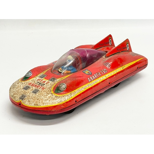 220 - A vintage Fiat Abarth 750 tin plate toy. Japan. 26cm