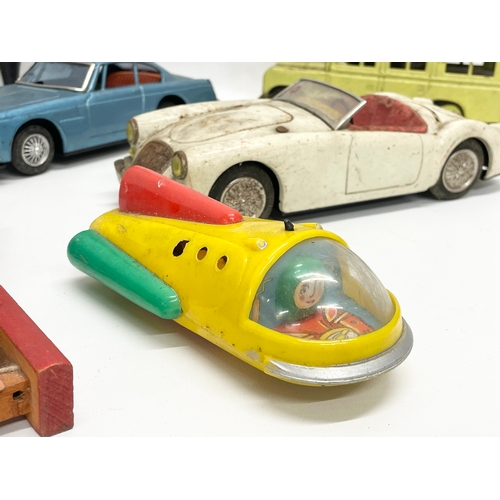 223 - A collection of vintage toys. 5 tin plate Japanese cars, Volkswagen, Ferrari, Land Rover etc 19cm, J... 