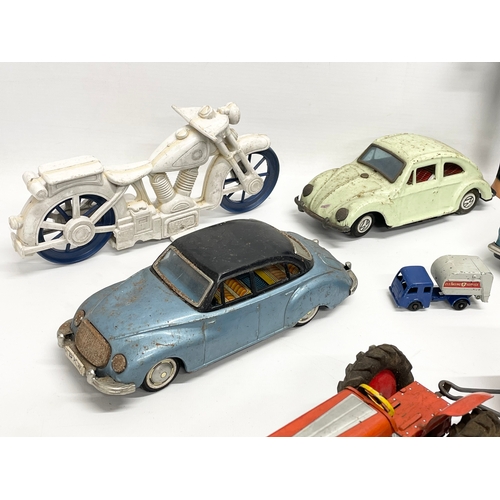 223 - A collection of vintage toys. 5 tin plate Japanese cars, Volkswagen, Ferrari, Land Rover etc 19cm, J... 