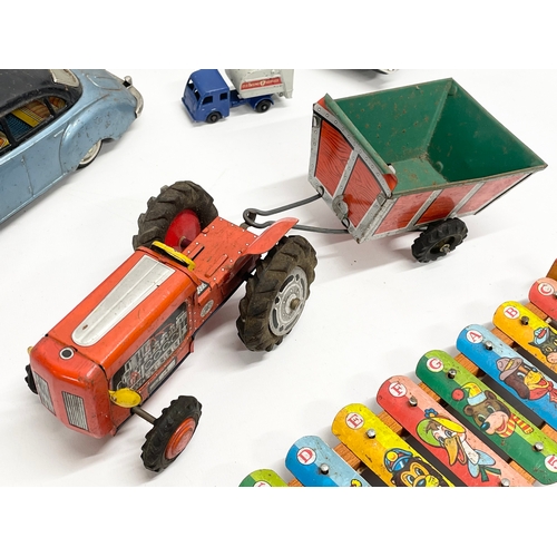 223 - A collection of vintage toys. 5 tin plate Japanese cars, Volkswagen, Ferrari, Land Rover etc 19cm, J... 