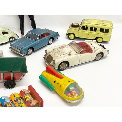 223 - A collection of vintage toys. 5 tin plate Japanese cars, Volkswagen, Ferrari, Land Rover etc 19cm, J... 