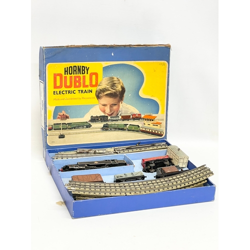 224 - A vintage Hornby Dublo Electric Train Set in box. Meccano LTD. 35x30cm