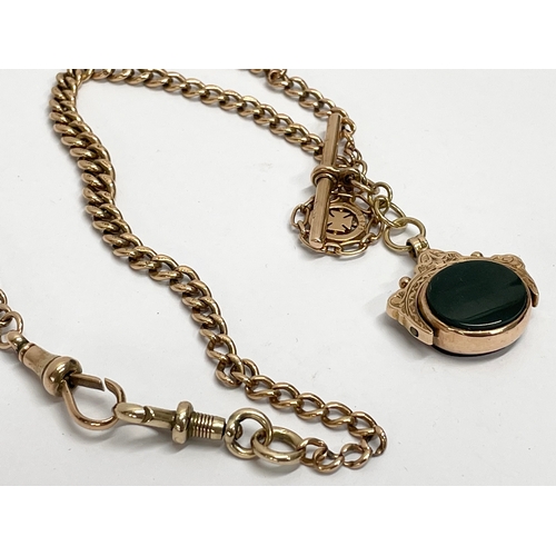 546 - A 9ct gold chain and fob necklace. 33.16 grams