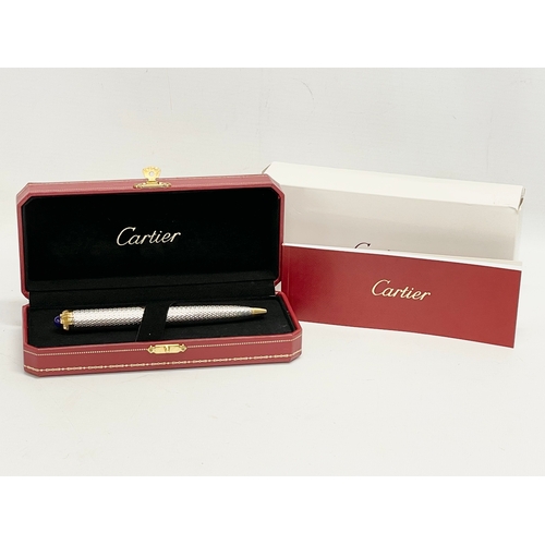 554 - A Cartier ballpoint pen in case and box.