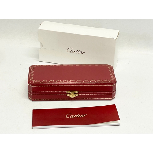 554 - A Cartier ballpoint pen in case and box.