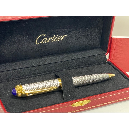 554 - A Cartier ballpoint pen in case and box.