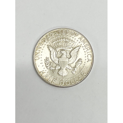 563 - A 1964 silver half dollar.