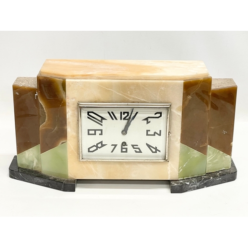 121 - A 1930’ Art Deco slate clock set by Marti Jours. Clock measures 42x11x21cm. Garnitures measure 14x8x... 