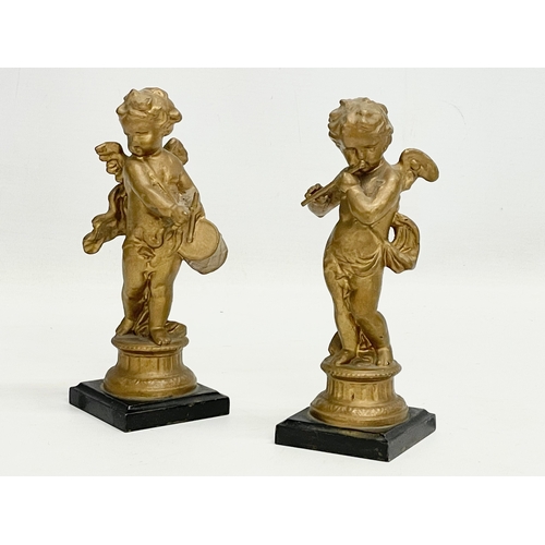 63 - A pair of mid to late 19th century gilt spelter cherub figures. 17.5cm