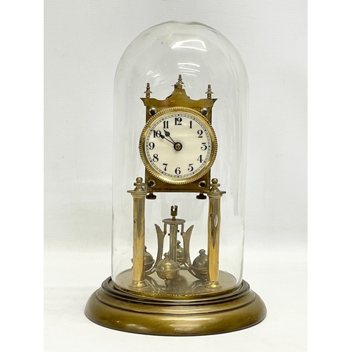 186 - An early 20th century brass Anniversary clock with glass dome. 32cm