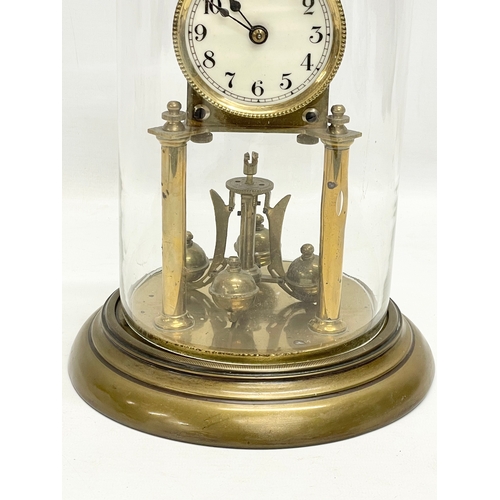 186 - An early 20th century brass Anniversary clock with glass dome. 32cm