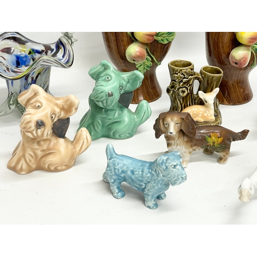 349 - A sundry lot of pottery. Including 4 Sylvac animals, a pair of Italian vases 15cm, 2 Nao swans etc