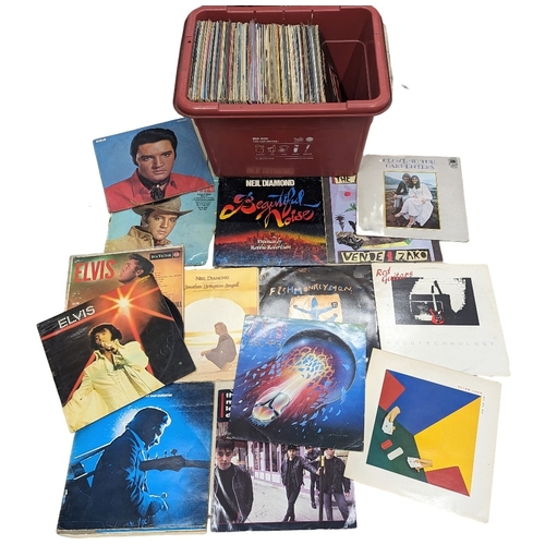 304 - A collection of vintage vinyl LP records including Elton John, Elvis, The Carpenters, Johnny Cash, e... 