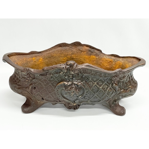 368 - A vintage cast iron planter. 44x21x21cm