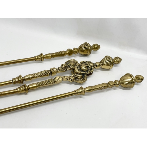 369 - 3 good quality Victorian heavy brass fire tools and a pair of vintage brass andirons. Tools measures... 