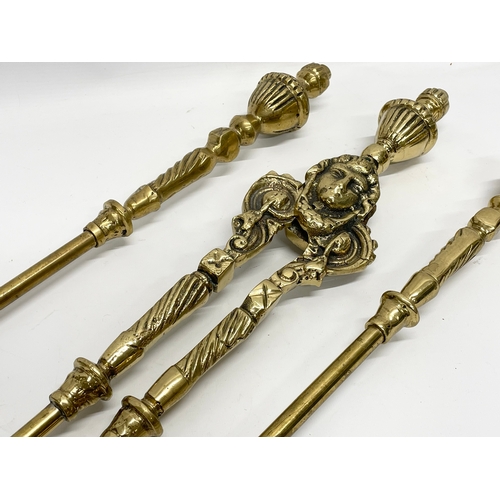 369 - 3 good quality Victorian heavy brass fire tools and a pair of vintage brass andirons. Tools measures... 