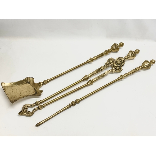 369 - 3 good quality Victorian heavy brass fire tools and a pair of vintage brass andirons. Tools measures... 