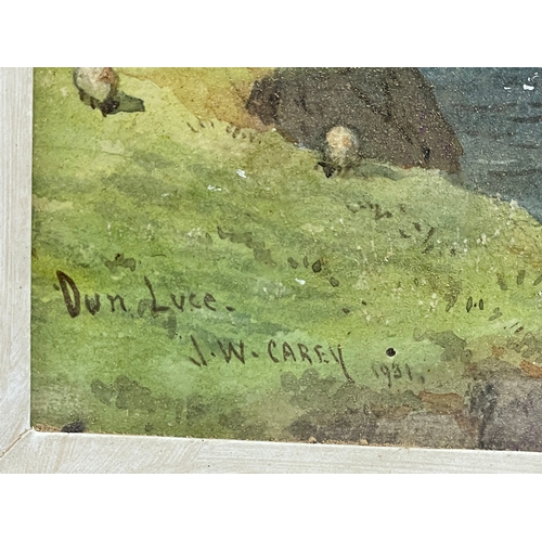 188 - A watercolour by J.W. Carey. Dunluce Castle. 1931. Painting measures 14x27cm. Frame 32x50cm