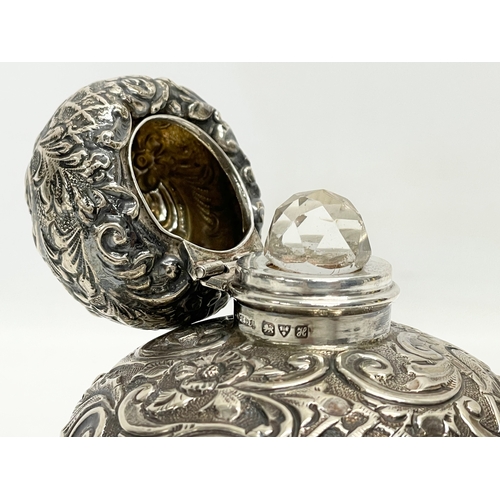 571 - A sterling silver perfume bottle. 8x10cm