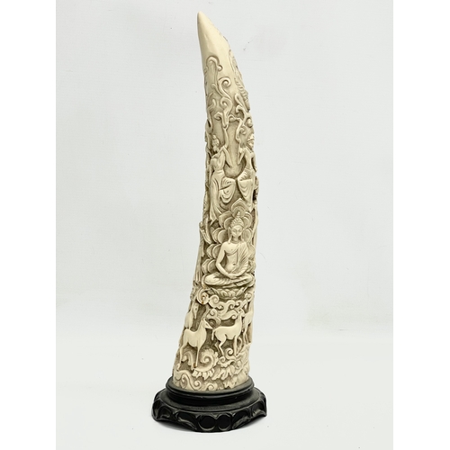 375 - A Chinese carved faux ivory horn. 42.5cm