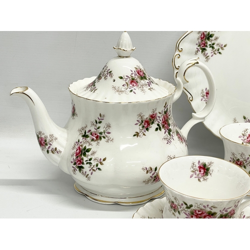 416 - A 21 piece Royal Albert Lavender Rose tea set. Teapot measures 25x20cm