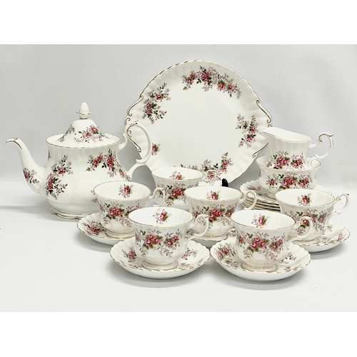 416 - A 21 piece Royal Albert Lavender Rose tea set. Teapot measures 25x20cm