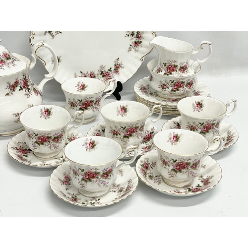 416 - A 21 piece Royal Albert Lavender Rose tea set. Teapot measures 25x20cm