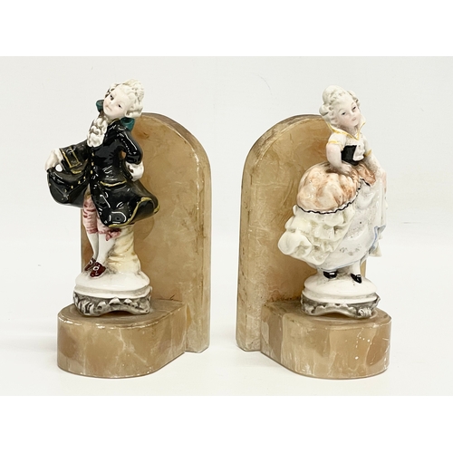 657 - A pair of vintage onyx and pottery bookends. 8.5x15.5cm