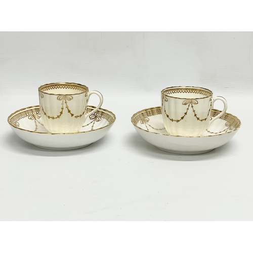 417 - A pair of early 19th century Crown Derby porcelain cups and saucers.