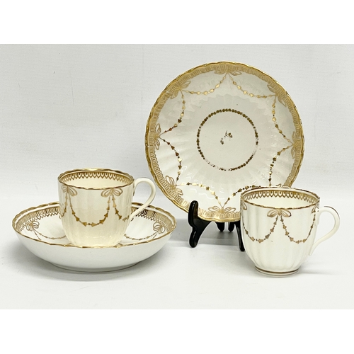 417 - A pair of early 19th century Crown Derby porcelain cups and saucers.