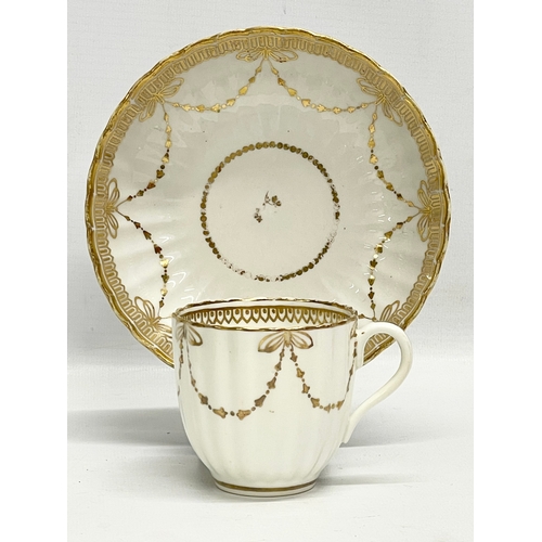 417 - A pair of early 19th century Crown Derby porcelain cups and saucers.