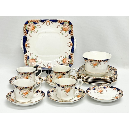 661 - A vintage 18 piece Heathcote China tea set.