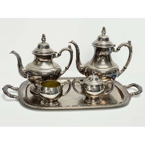 664 - A vintage 5 piece silver plated tea service. Tray measures 55cm.