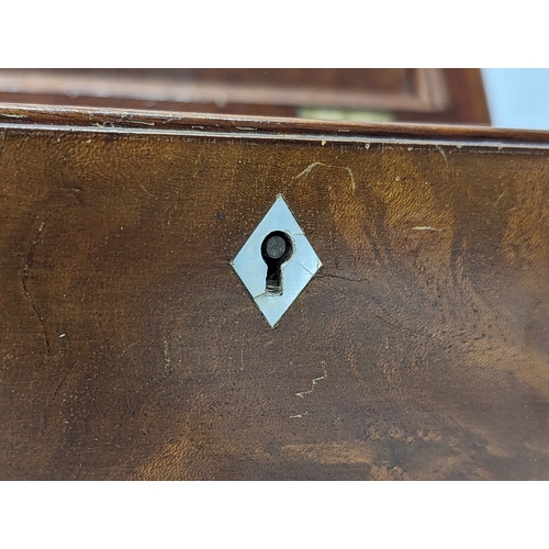 129 - An Edwardian mahogany jewellery box. 32x19x14cm